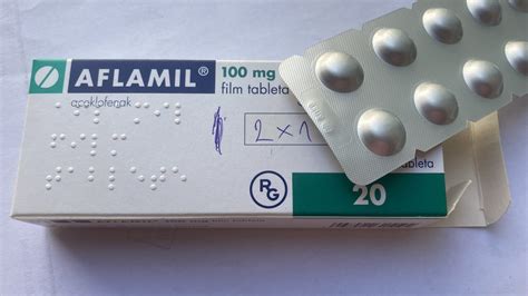 Fľaša lieku Aflamil s tabletami
